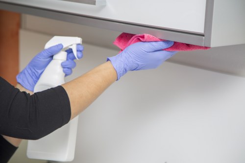 Cleaning technician preparing products and assessing workplace risks before service